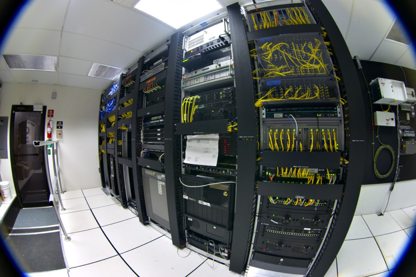 Datacenter hall with rows of server racks