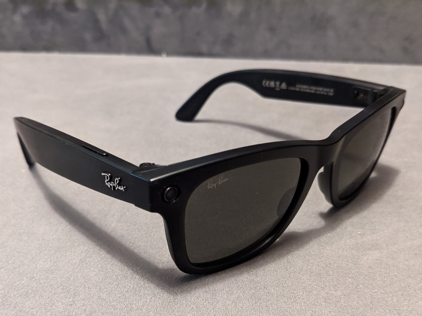 Ray-Ban × Meta smart glasses, Wayfarer frame, with a front-facing camera and speakers — the ambient-computing form factor